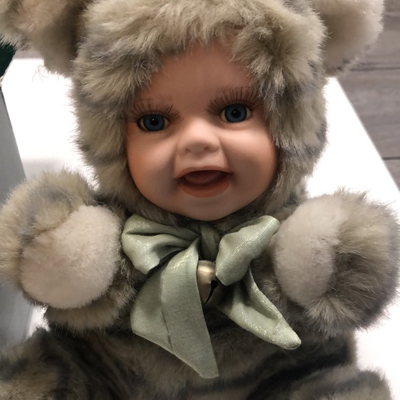 Geppeddo porcelain doll with a cat outfit that is striped and sage bow with bell - Picture 2 of 8